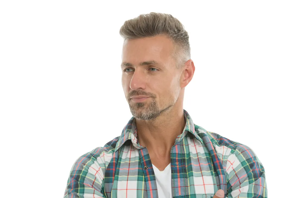 Short textured men’s haircut with gray hair